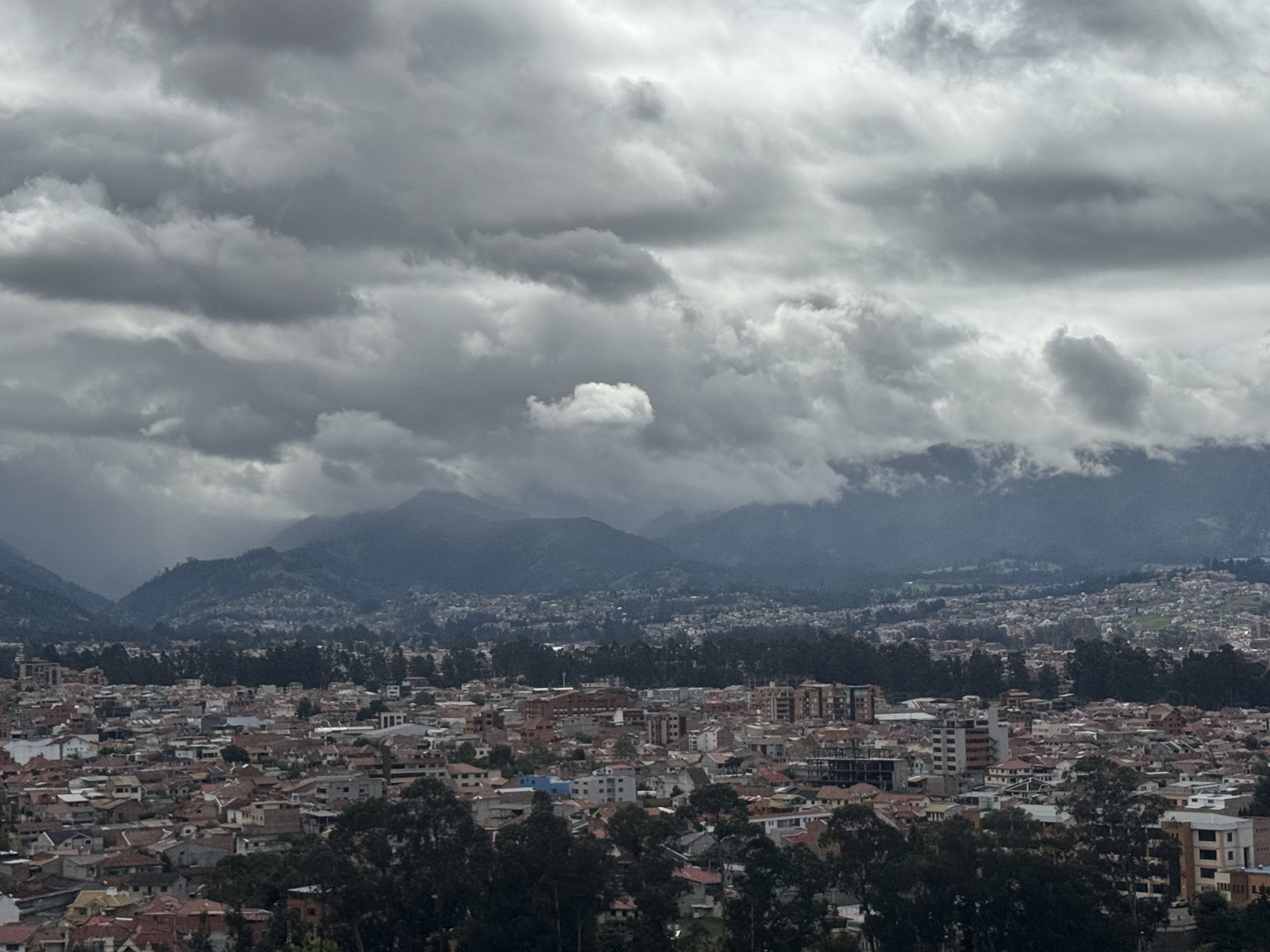 Heavy clouds over the Ecuadorian Andes above a highland city